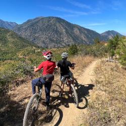 mountain bikers on a trail over-looking Leavenworth